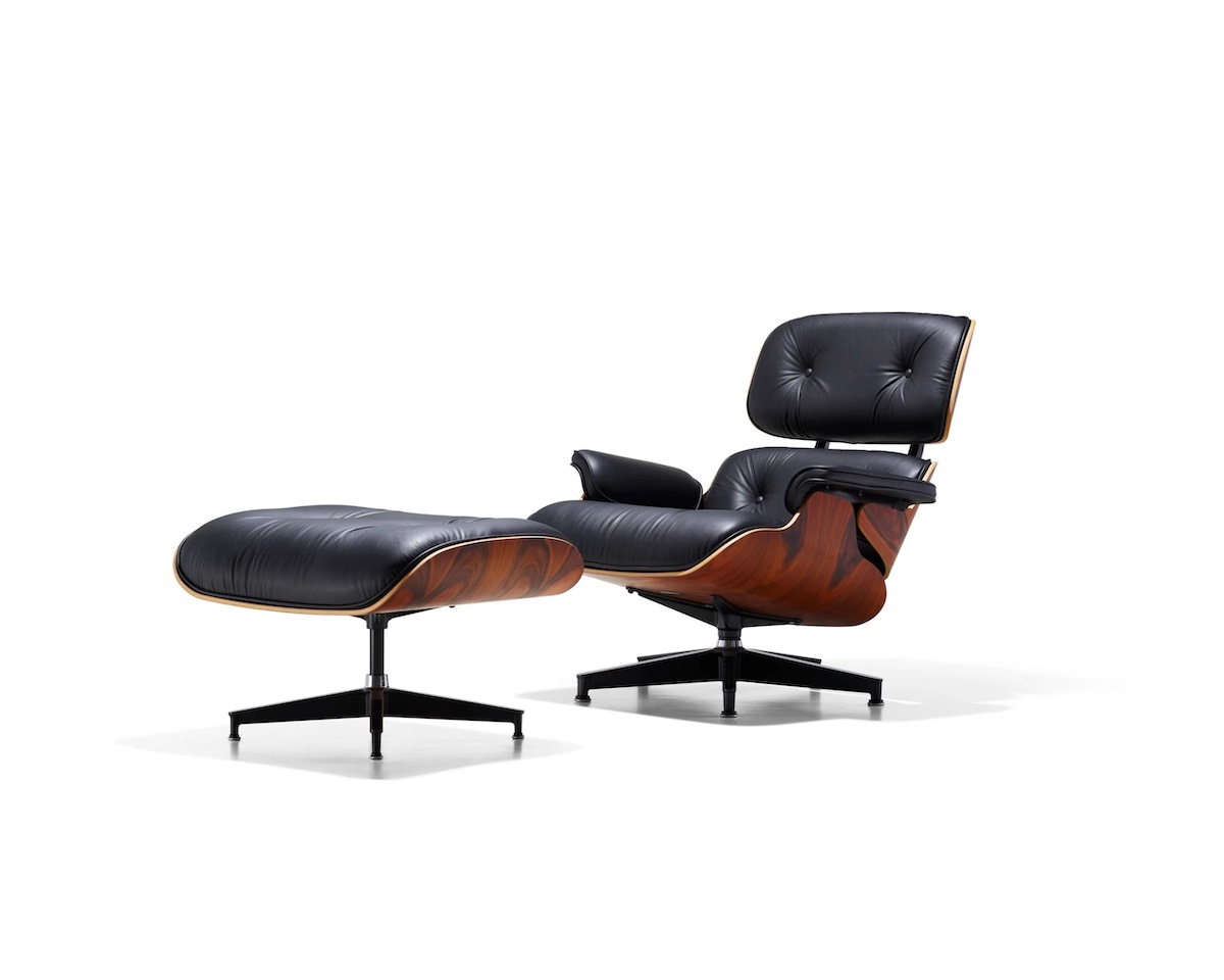 Eames chair by Herman Miller in Black and walnut on a white background